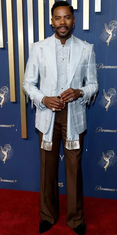<p>Actor Colman Domingo at the 2025 Emmy Awards wearing a crystal embellished Valentino suit and aquamarine and morganite rings by Boucheron</p>
