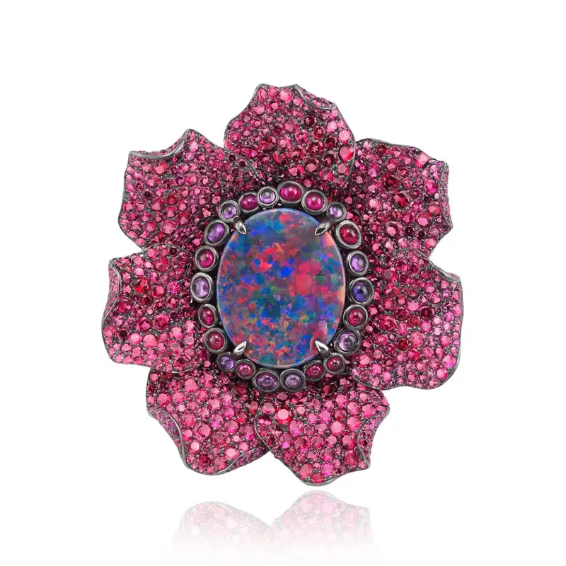 <p>Fleurs d’Opales ring with white and rose gold, titanium and zirconium, multi-coloured sapphires, rubies, garnets, black diamonds and a black opal of 9 cts</p>
