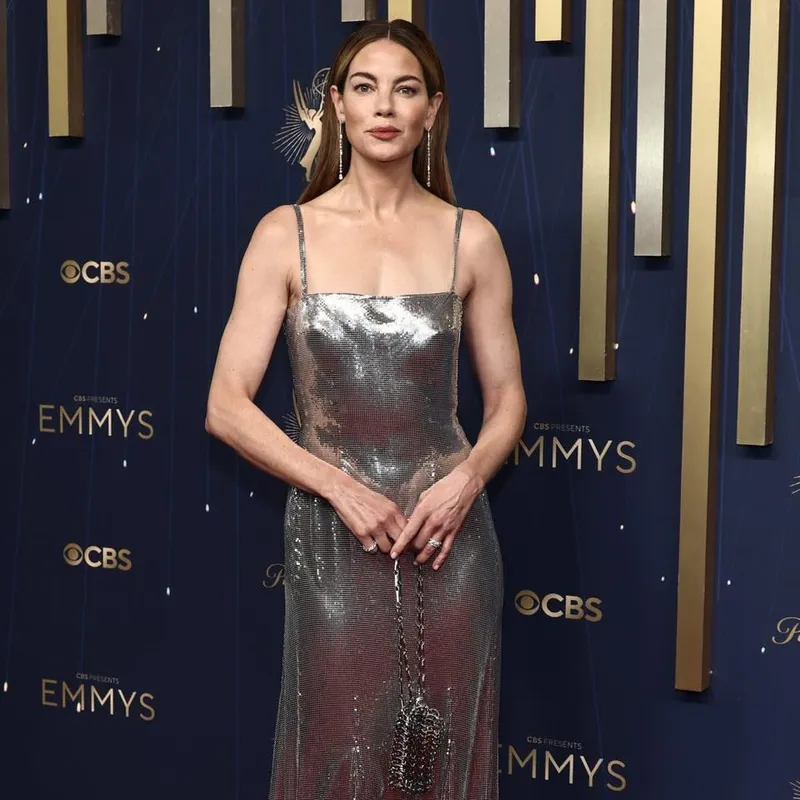 <p>Actress Michelle Monaghan attends the 2025 Emmy Awards wearing the De Beers Snow Dance long diamond earrings with 5.14 carats of diamonds in 18k white gold, alongside the De Beers Classic eternity band with 6.58 carats of diamonds in platinum and the De Beers Arpeggia Three Row diamond ring  with 1.65 carats of diamonds in 18k white gold</p>
