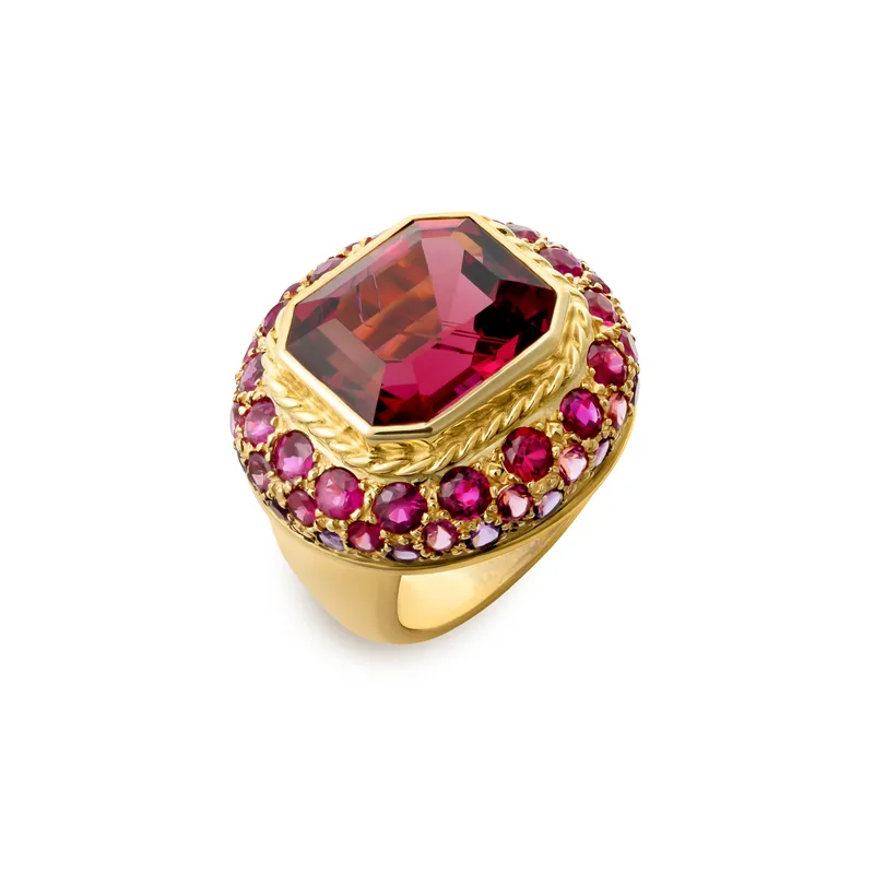 <p>Rubellite, ruby and amethyst ring from the Elizabeth Gage New York Collection 2025, set with an octagon-shaped faceted rubellite of 12.57 carats, 16 faceted round rubies of 2.75 carats total, and further faceted round rubellites and amethysts in 18k yellow gold</p>