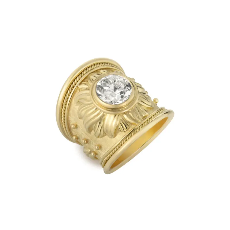 <p>Elizabeth Gage Sun ring with a flame motif and bead detailing, set with a round old-cut diamond of 2.98 carats in 18k yellow gold</p>