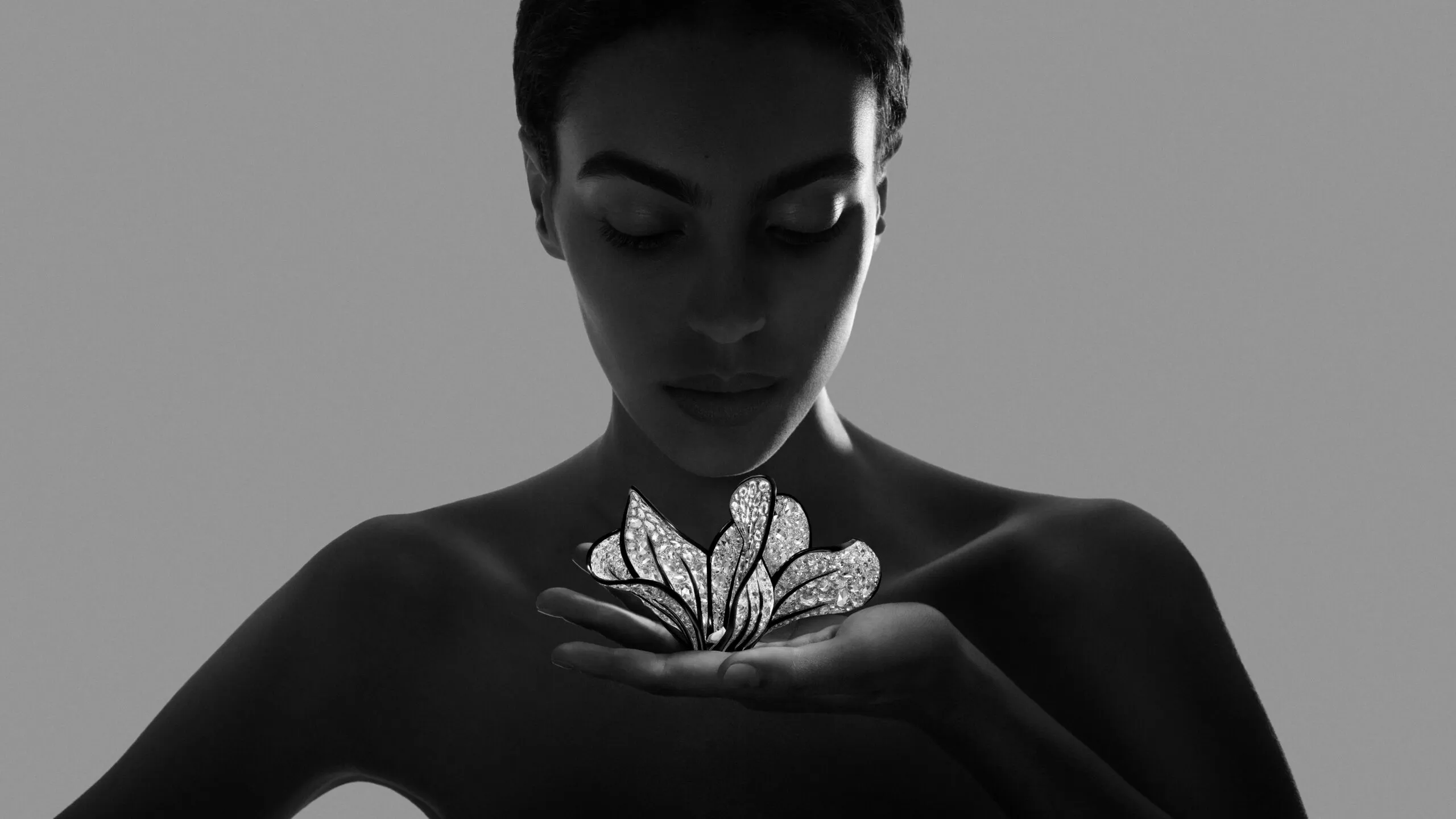 <p>Cyclamen transformable brooch-bracelet from Composition No.4 of the Boucheron Impermanence High Jewellery collection, crafted in white gold, 700 rose-cut diamonds, round brilliant-cut diamonds, black lacquer, and rock crystal</p>