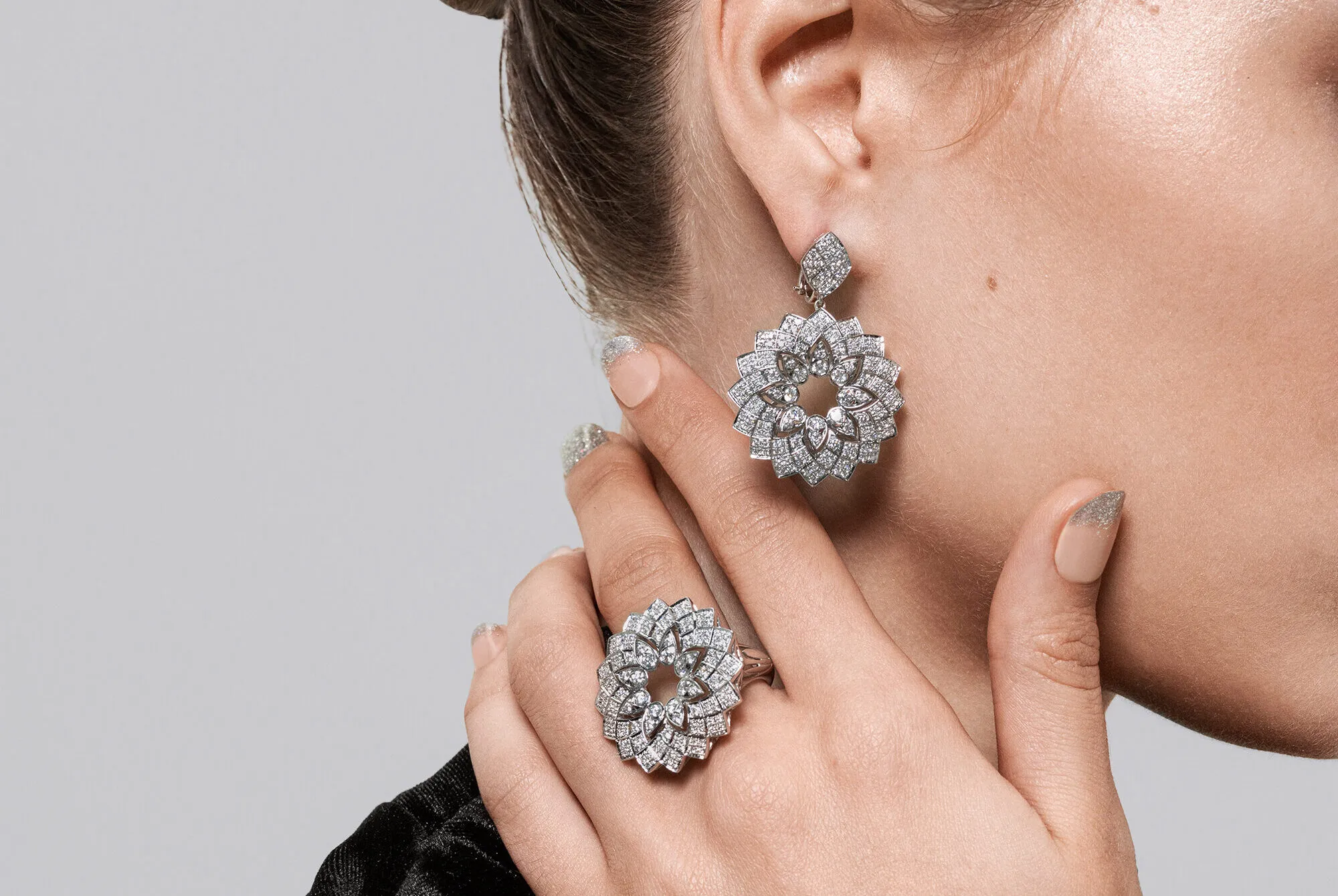 <p>A model wears pieces by Couture Show 2025 debutant BijouQ, including the Classic Geomatrica earrings with 3.27 carats of diamonds and the matching Classic Geomatrica ring with 1.44 carats of diamonds, both in 18k white gold </p>
