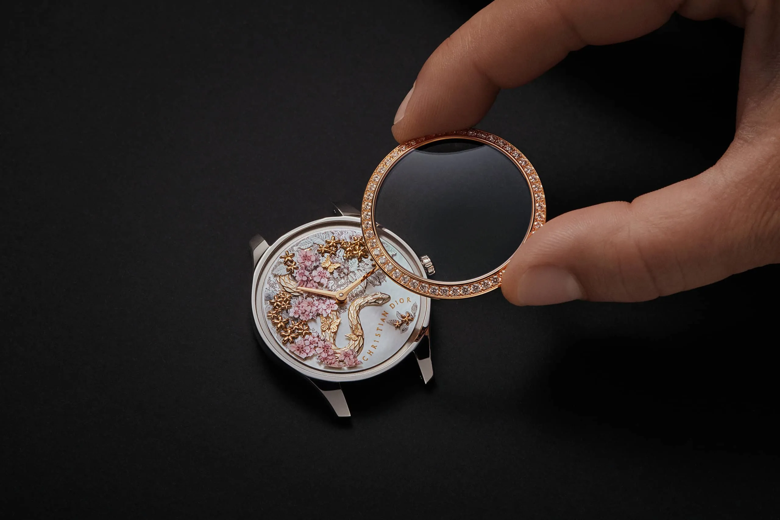 <p>Adding the finishing touches – a diamon-set bezel – to the Dior Grand Soir Year of the Snake watch</p>
