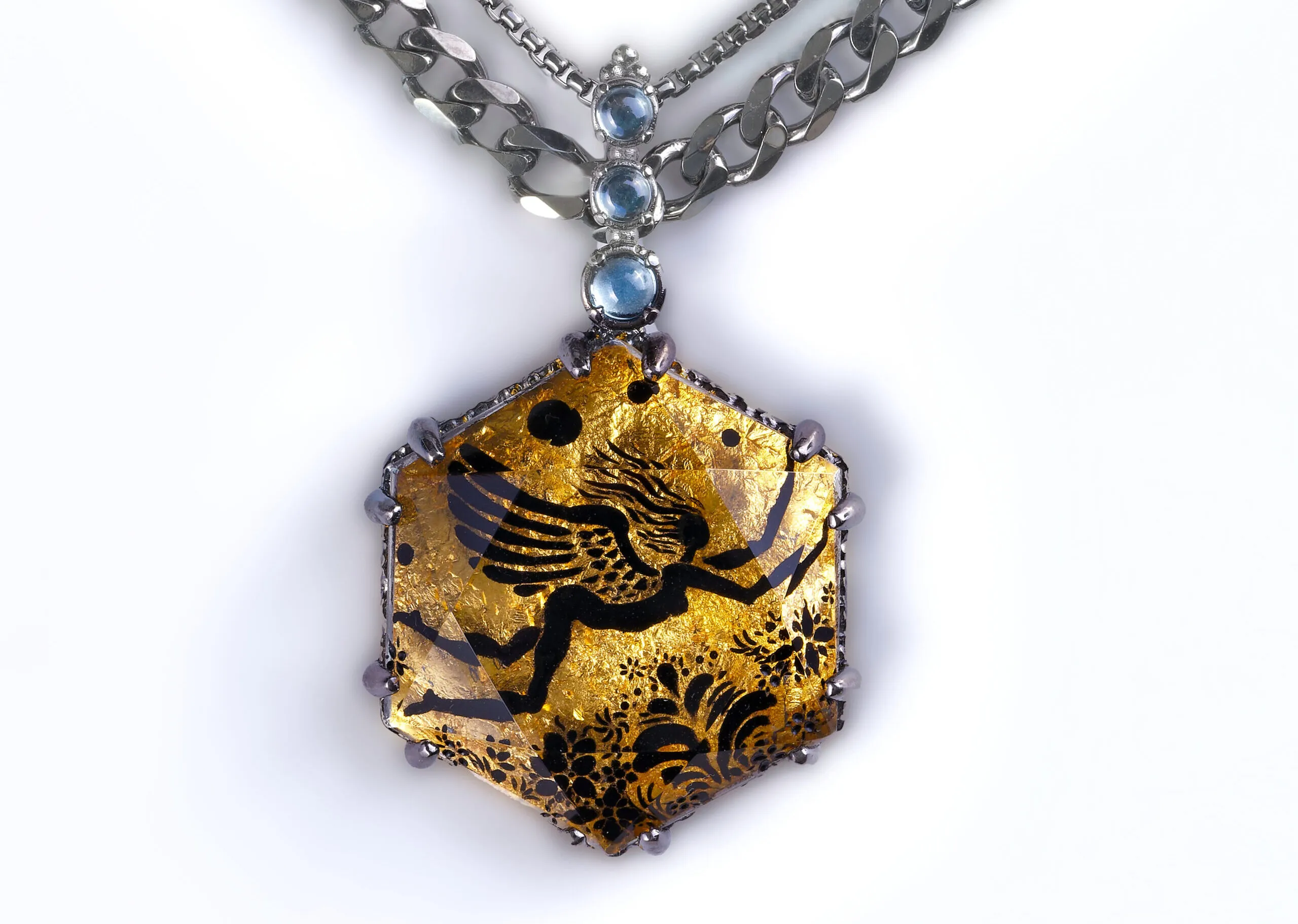 <p>Eros-Psyche Mother Goddess of Love glyptic pendant with rock crystal, sky blue topaz and 24k gold in sterling silver and black platinum plating (ruthenium)</p>
