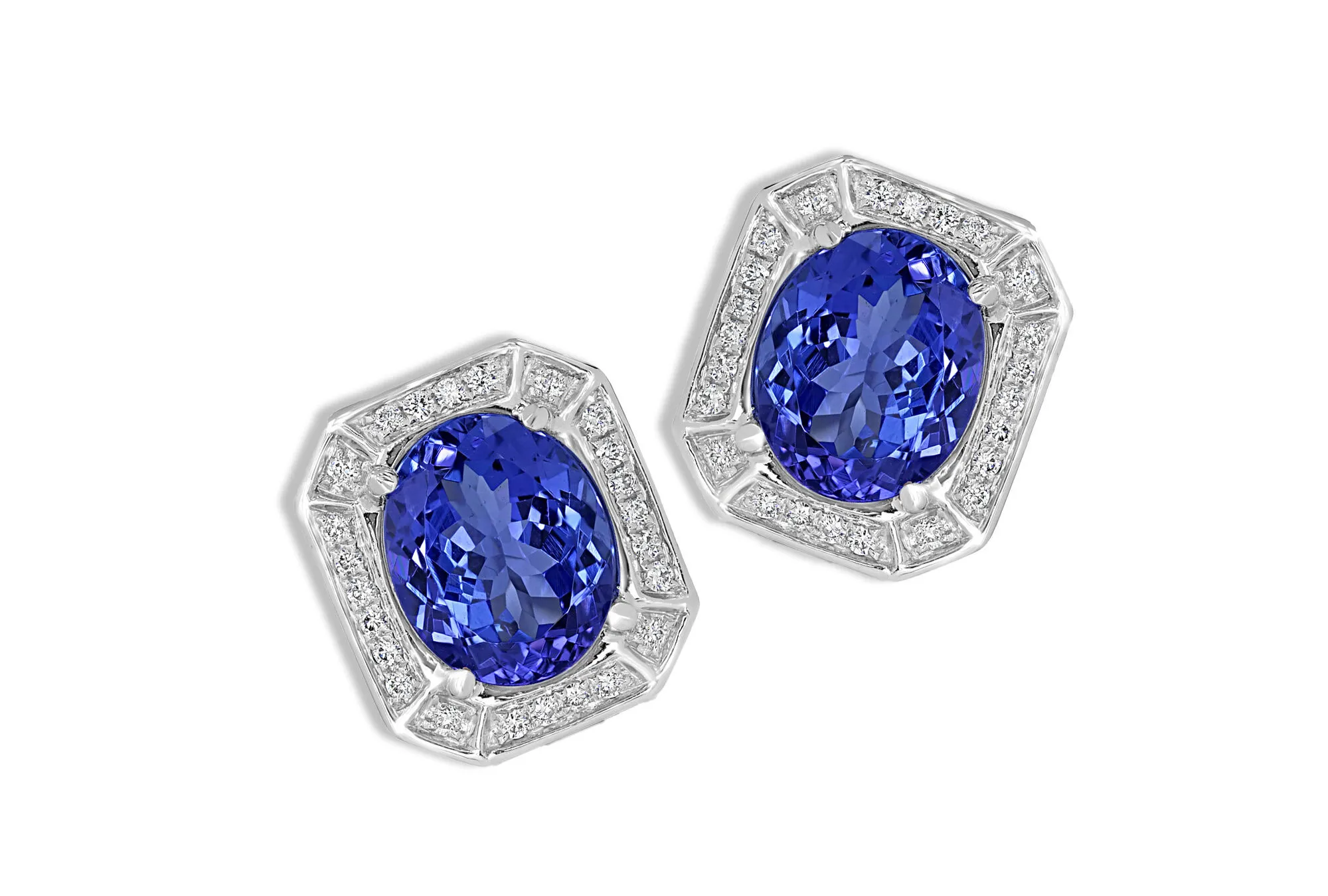 <p>Royal Touch Group earrings with 6.21 total carats of oval-shaped tanzanites and diamonds set in 14k white gold </p>
