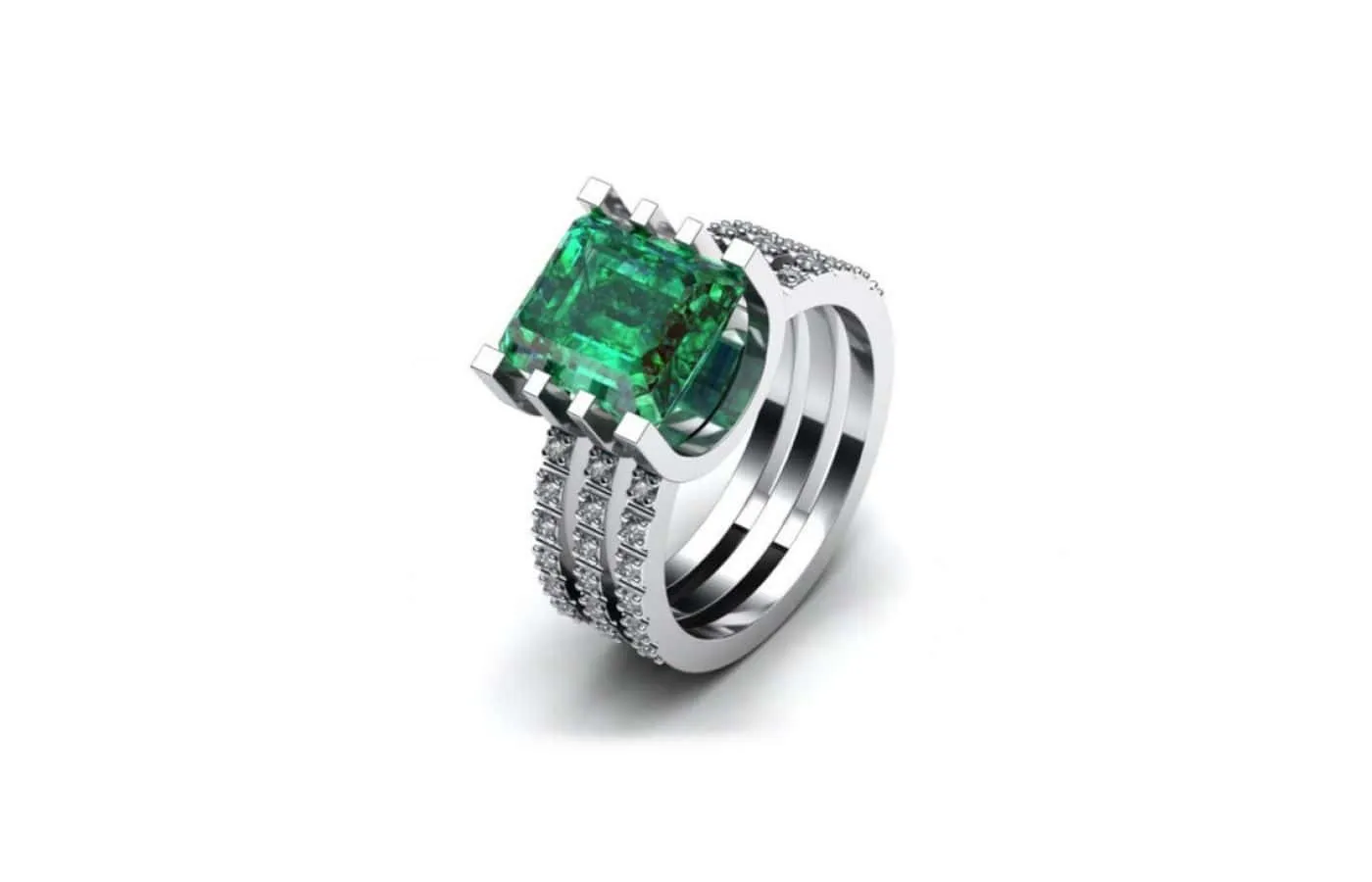 <p>Korbička Šperky ring in 18k white gold with an emerald and three rows of diamonds</p>