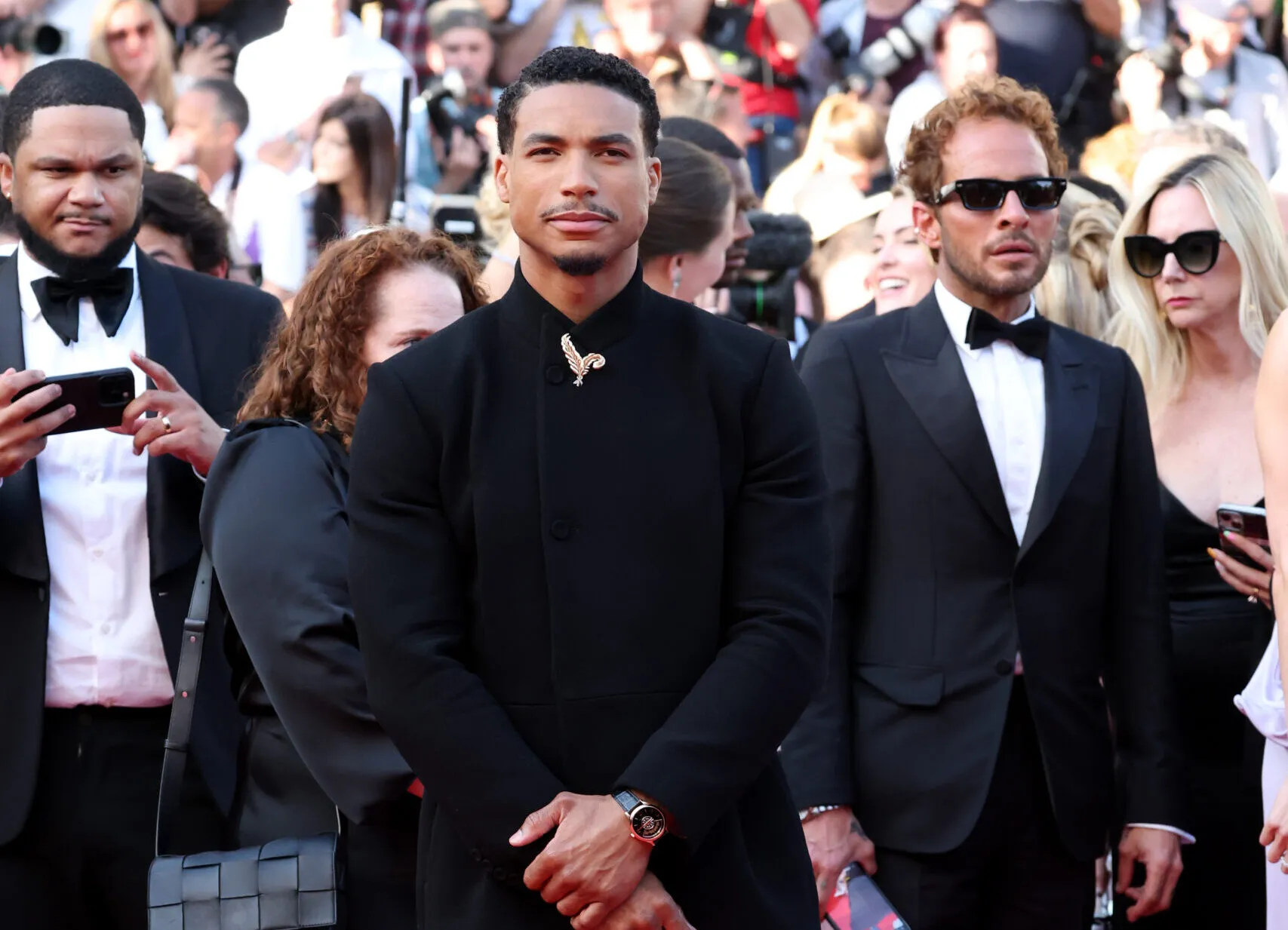 <p>American actor Greg Tarzan Davis adorns his suit with a Chopard feather brooch at the Cannes Film Festival 2025</p>
