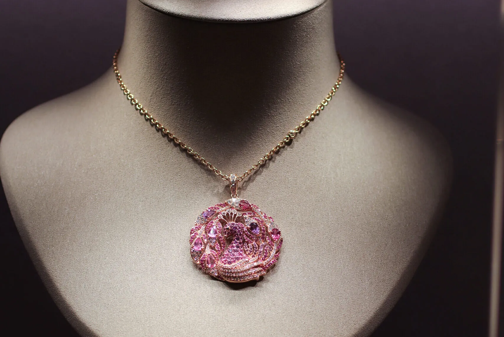 <p>Jaipur Gems peacock-inspired pendant necklace with pink and purple mixed-cut gemstones and diamonds, photographed at the brand&#8217;s Abu Dhabi boutique</p>
