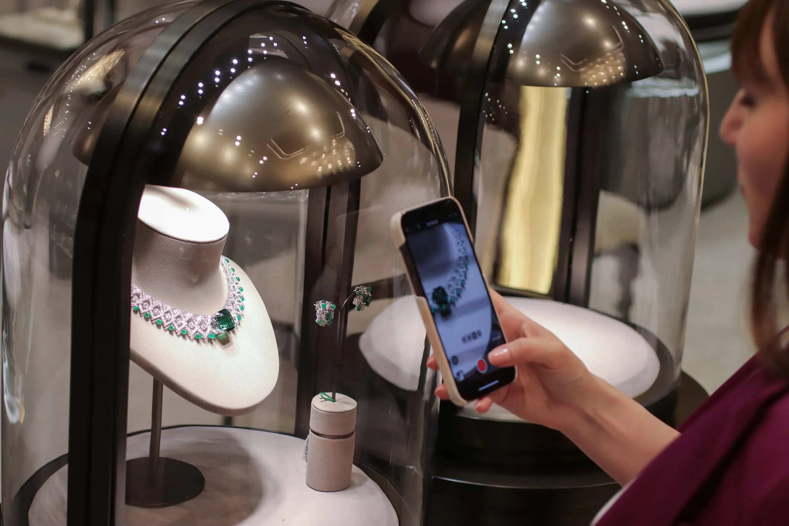 <p>Katerina Perez photographs the Jaipur Gems Soraya necklace with a 48-carat bluish-green tourmaline from Afghanistan, surrounded by diamonds and emeralds in a geometric design</p>
