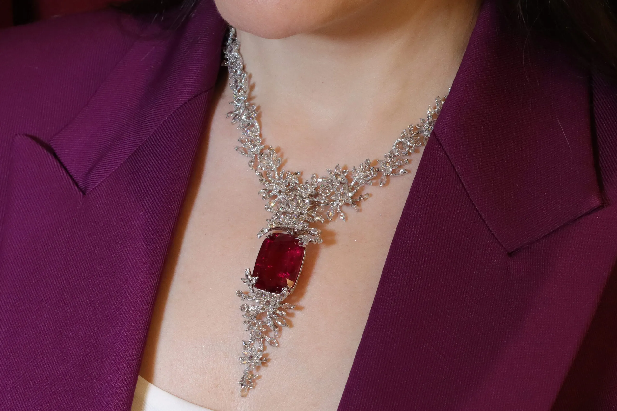 <p>Katerina Perez wears the Jaipur Gems Rubellite Rhapsody necklace with a 45-carat fuchsia rose rubellite from Afghanistan surrounded by diamonds </p>
