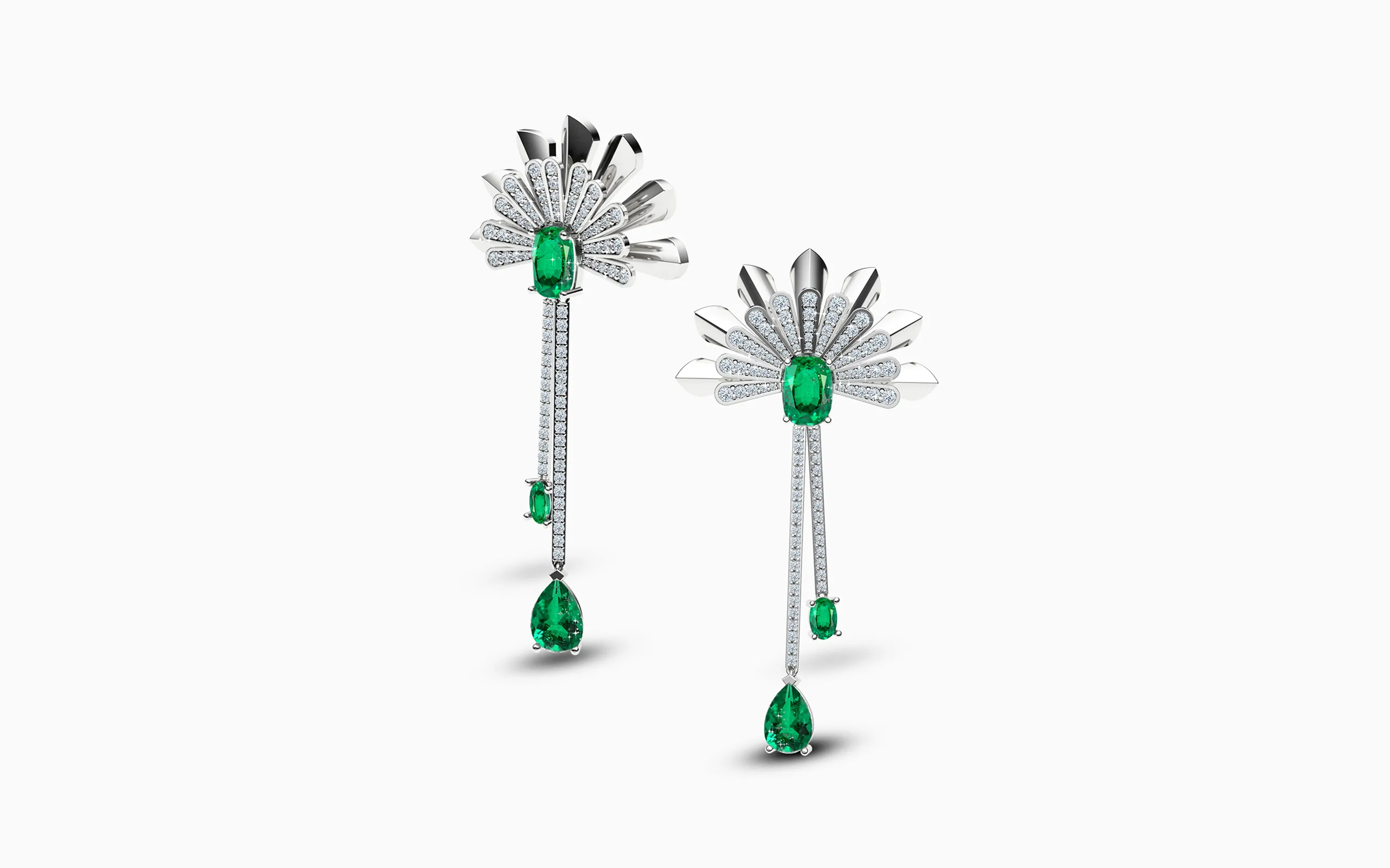 <p>A pair of Art Deco-inspired earrings by Korbička Šperky with pear and oval-shaped emeralds and diamonds, set in 18k white gold </p>
