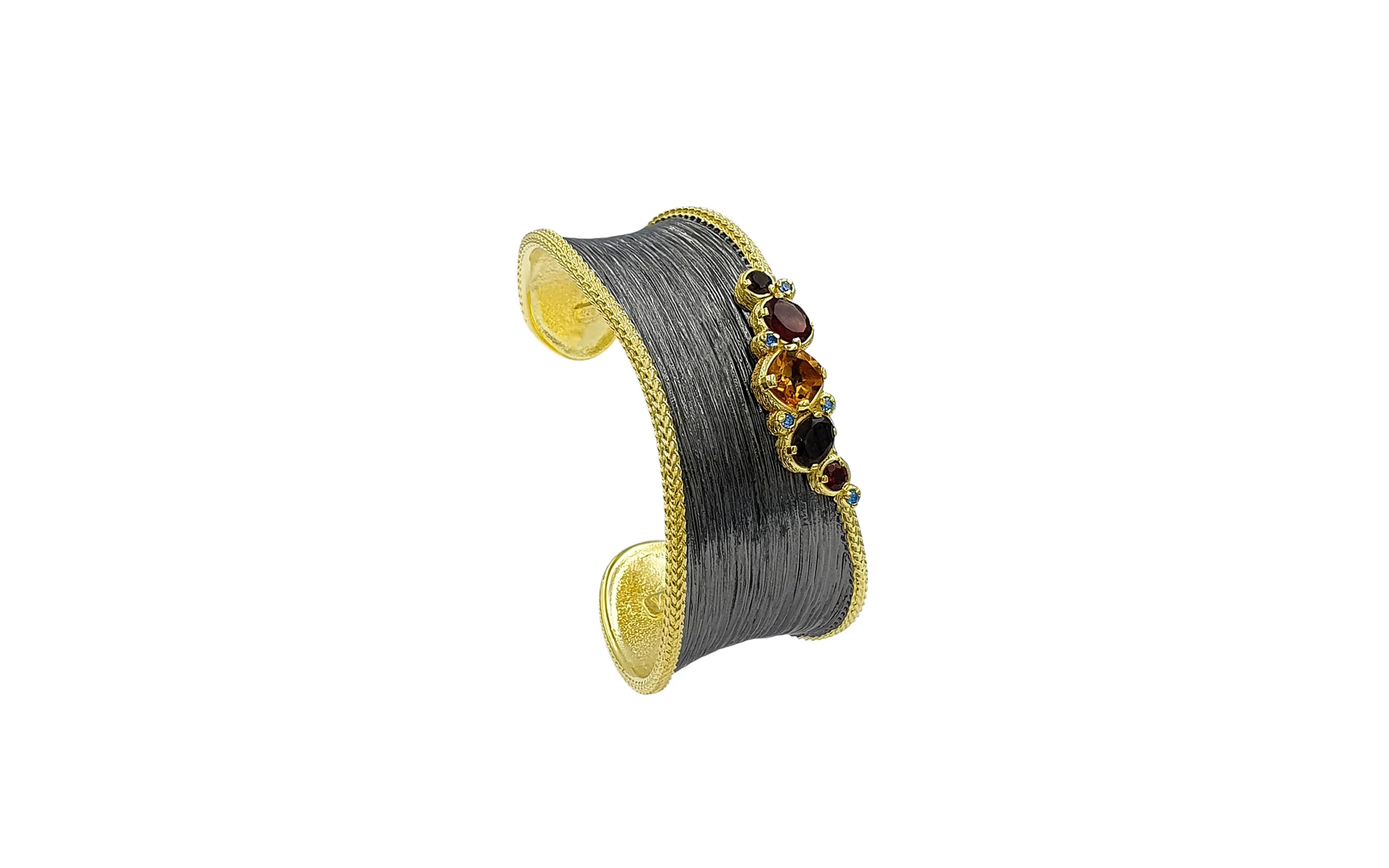 <p>MJM Jewels by Markella cuff bracelet in black rhodium- and yellow gold-plated sterling silver with multi-coloured gemstones </p>

