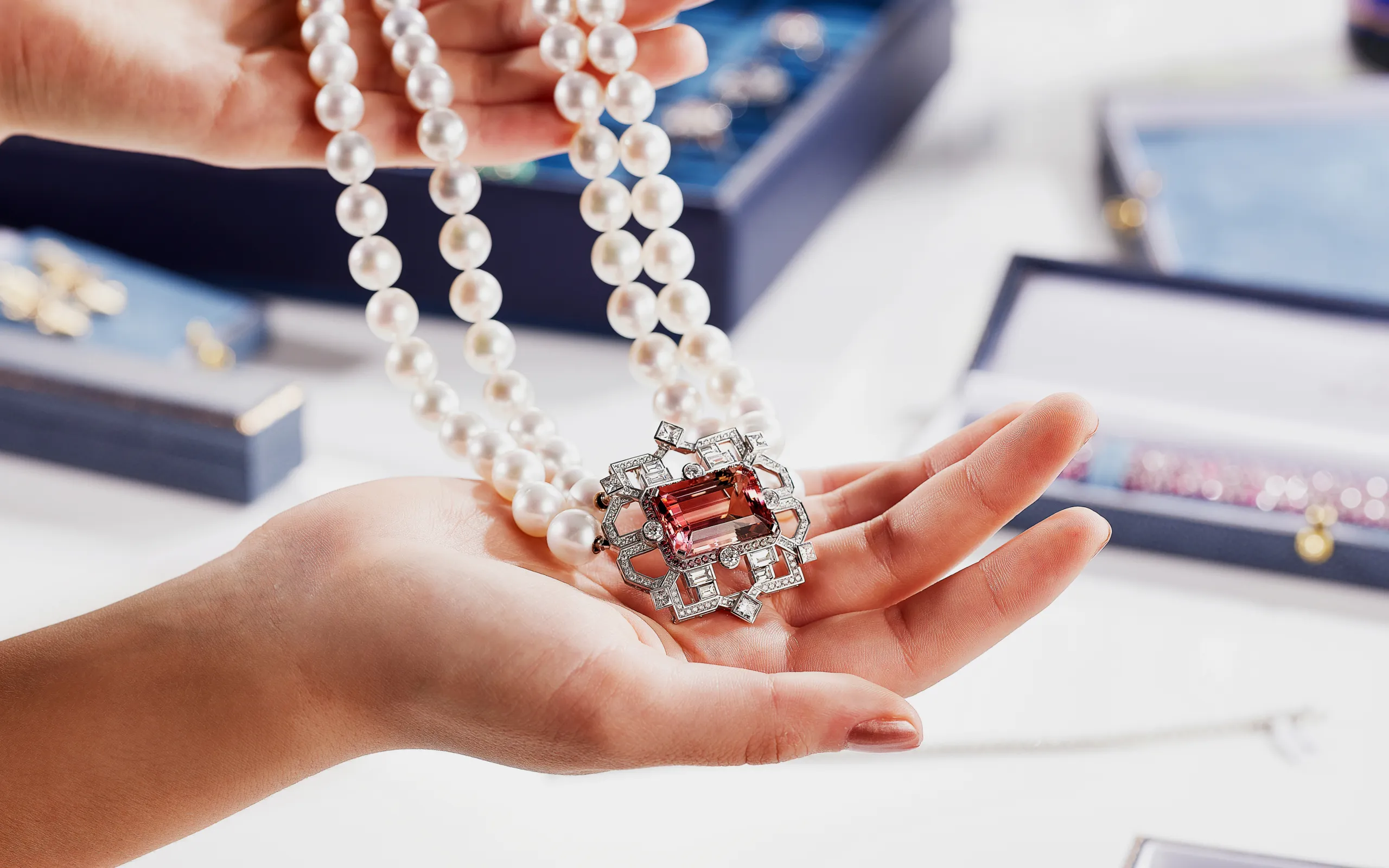 <p>A transformable brooch-pendant by Matthew Ely, featuring a 24.34 carat bi-colour tourmaline surrounded by colour fade sapphires and diamonds, crafted in 18k white gold </p>