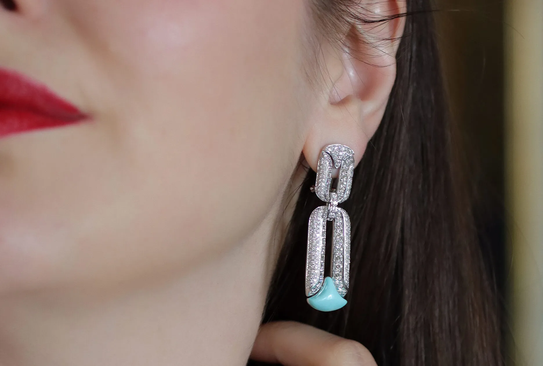 <p>Katerina Perez wears a pair of Miseno Arco High Jewellery earrings with diamonds and turquoise, set in white gold</p>
