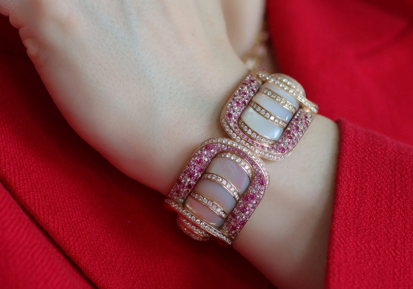 <p>Katerina Perez wears the Miseno Arco High Jewellery bracelet with 7.1 carats of mother of pearl, 7.88 carats of pink sapphire and 4.99 carats of white diamonds, set in 18k pink gold</p>
