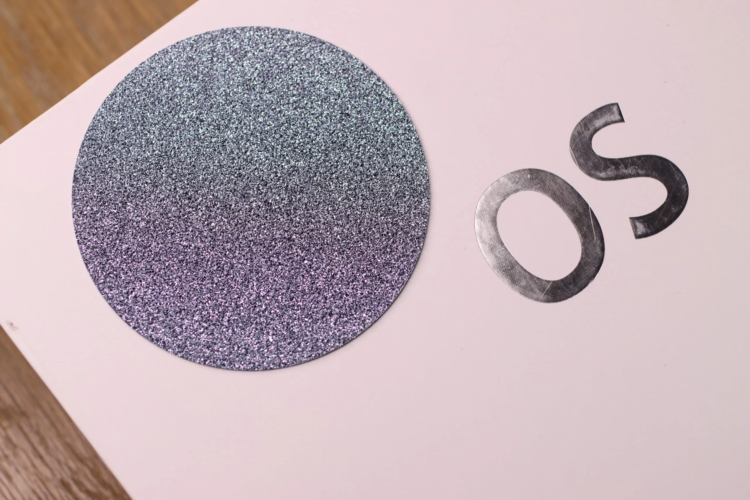 <p>A large, flat disc of crystalline osmium that can be cut into shapes and set into fine and high jewellery creations</p>