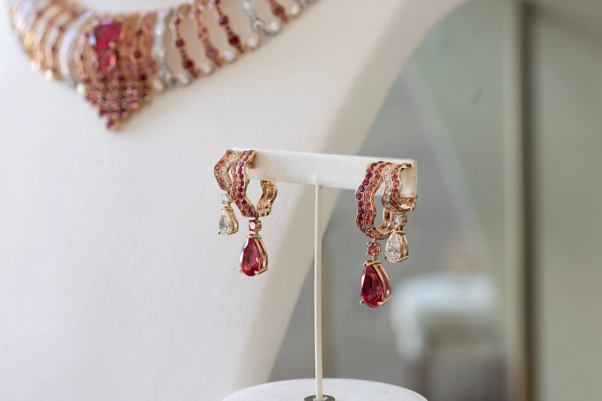 <p>The Wave Illusion earrings, set with two pear shape red Tanzanian spinels of 4.38 and 3.79 carats, two pear shape diamonds, spinels, rubies and diamonds in 18K rose gold </p>
