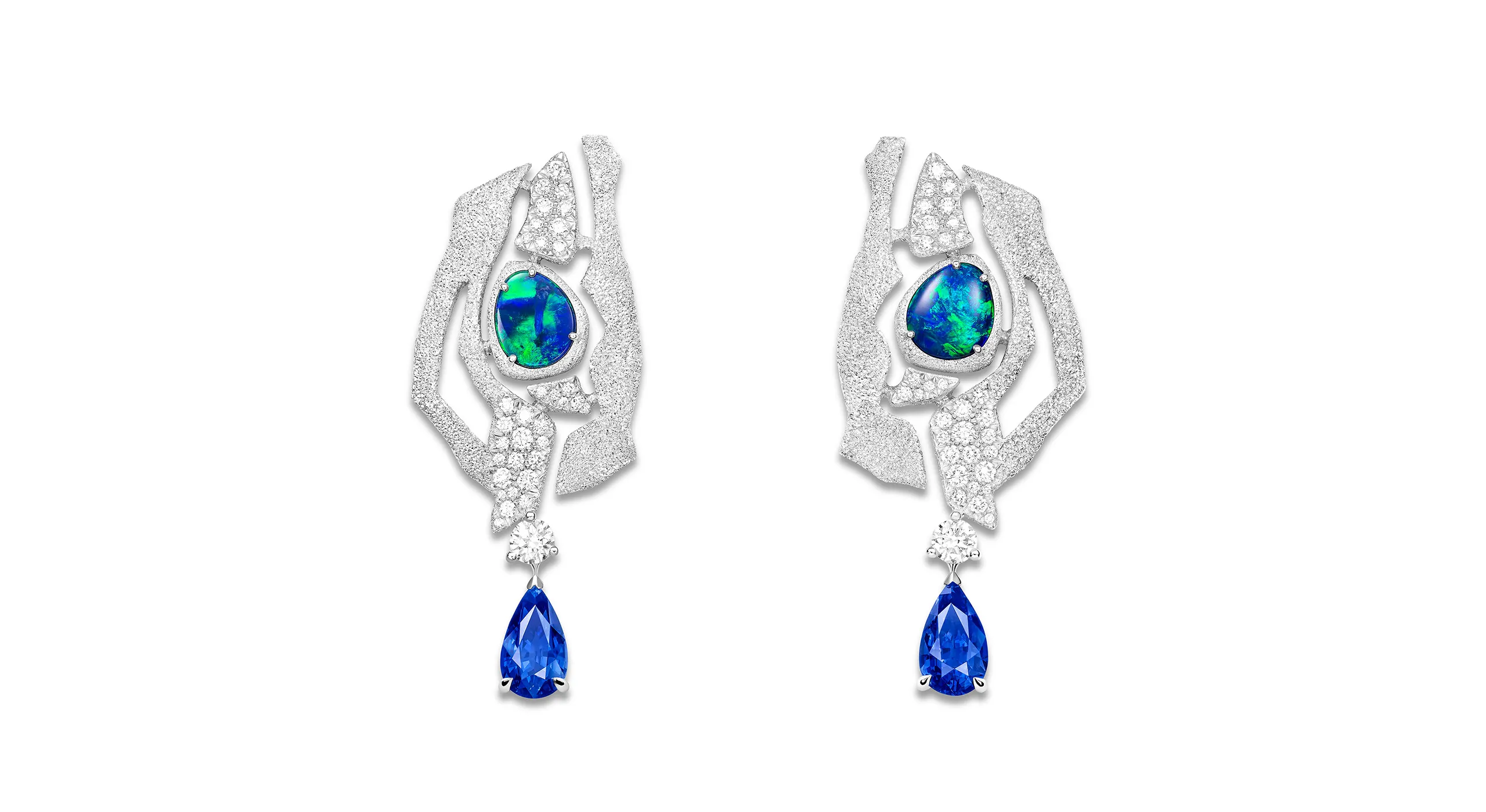 <p>The Flowing Curves earrings, set with two pear shape Madagascan sapphires, black Australian opals and diamonds in 18K white gold</p>
