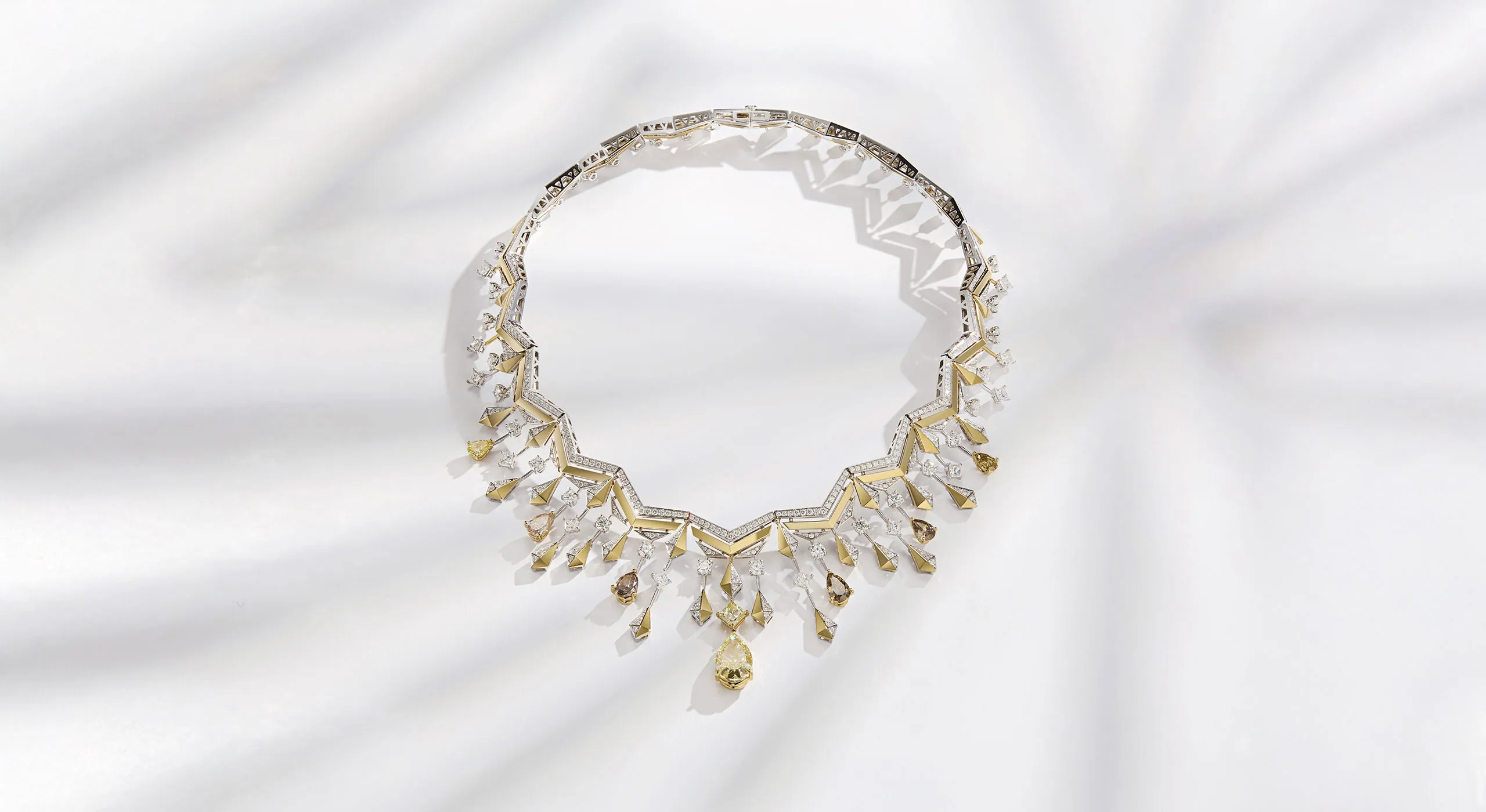 <p>Sahag Arslanian Celestial Radiance Grand Collier with a 6.35-carat pear-shaped fancy yellow VS1 diamond, surrounded by 4.76 carats of pear-shaped yellow-brown diamonds, cushion-cut fancy colour diamonds, 2.78 carats of princess-cut white diamonds, 8.53 carats of round white diamonds and 11.36 carats of further melee diamonds, set in 18k white and yellow gold </p>
