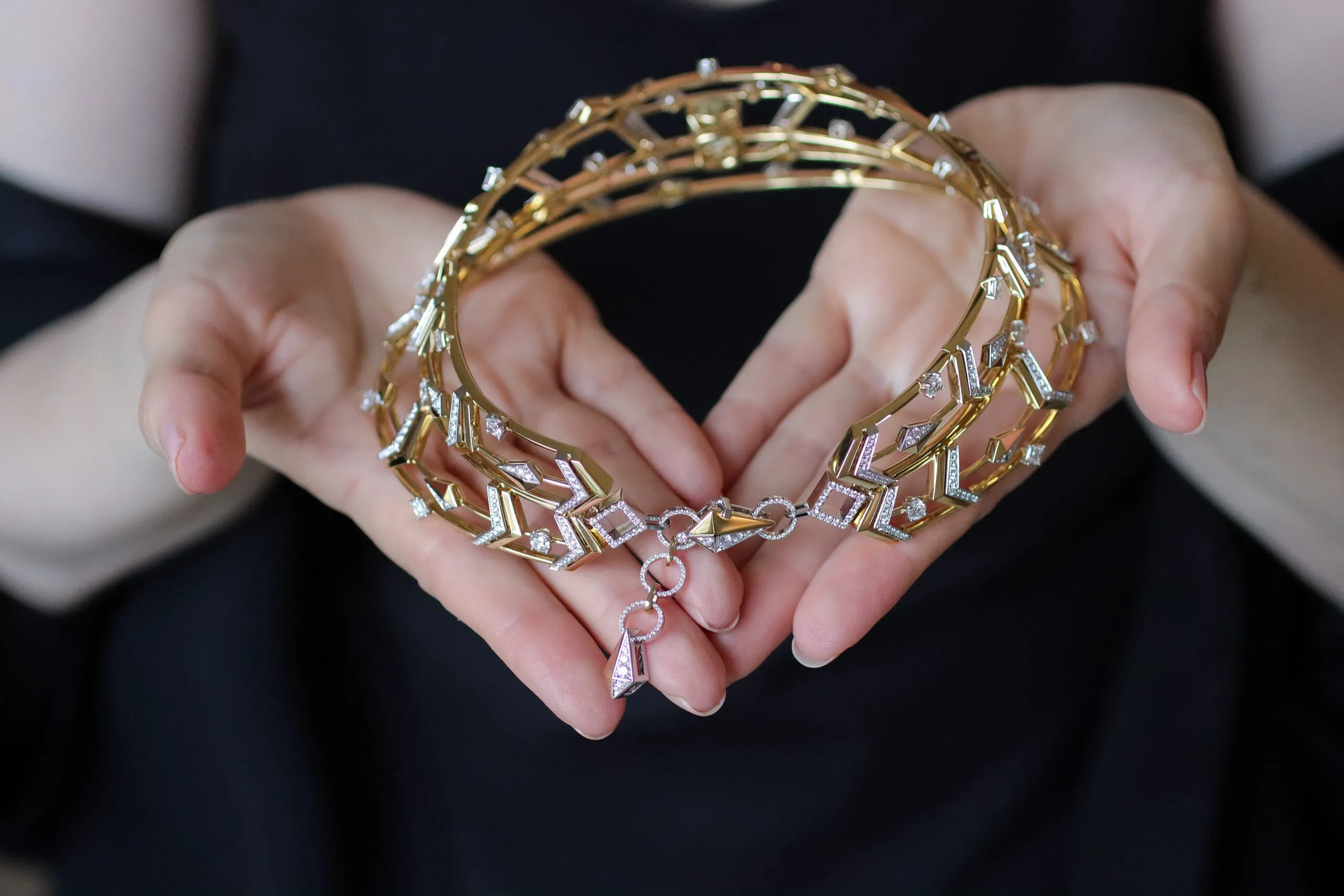 <p>The decorative clasp of the Sahag Arslanian High Jewellery choker from the Celestial Radiance collection with a 10.26-carat cushion-cut fancy deep brownish yellow VS2 diamond, 5.04 carats of princess-cut white diamonds, 5.49 carats of round white diamonds, and 4.83 carats of round white melee, set in 18k white and yellow gold</p>
