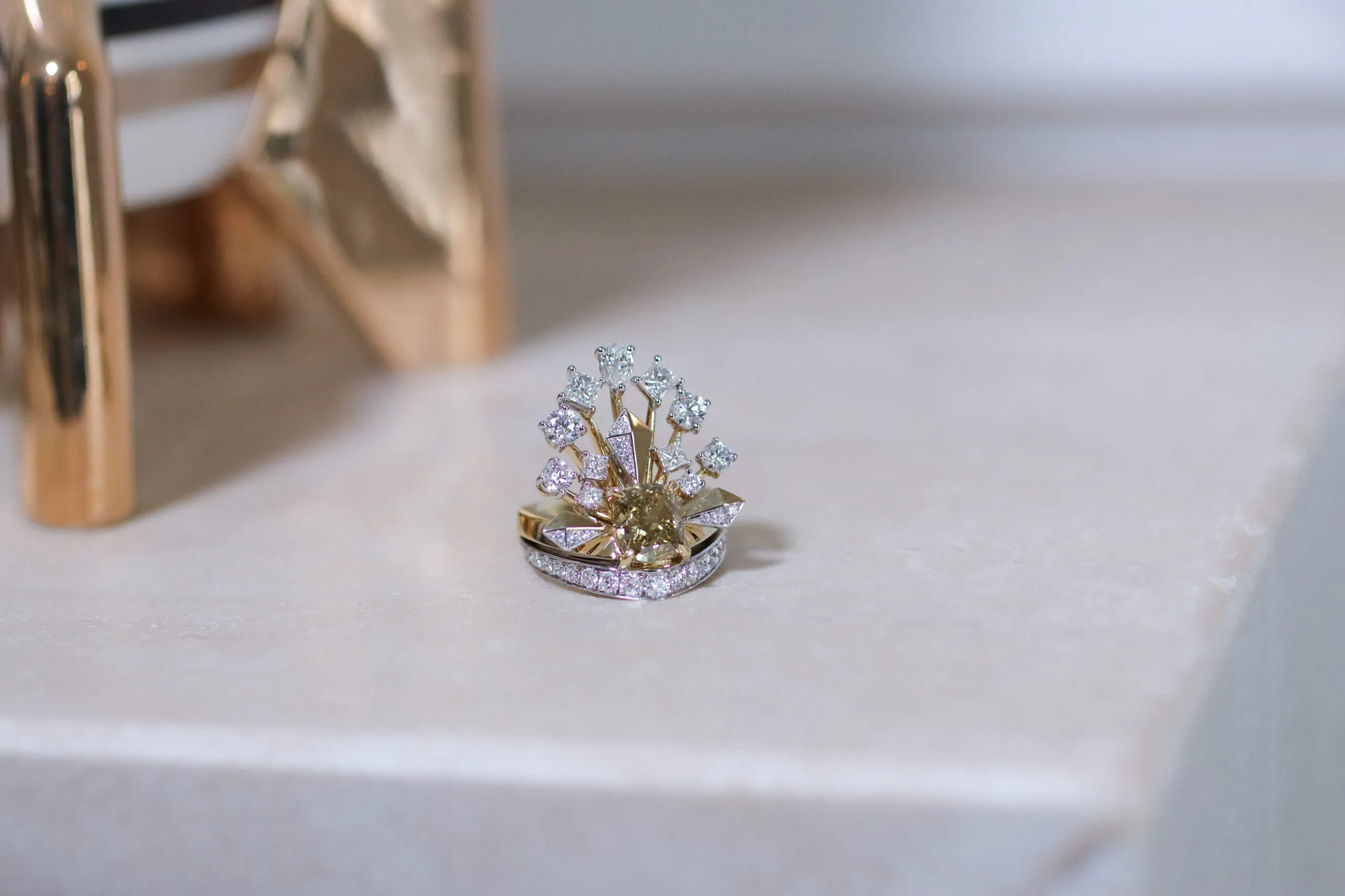 <p>Sahag Arslanian Celestial Radiance High Jewellery ring with a 2.44-carat cushion-cut fancy dark brown-yellow diamond surrounded by further pear-shaped, princess-cut and round brilliant-cut white diamonds set in 18k white and yellow gold  </p>
