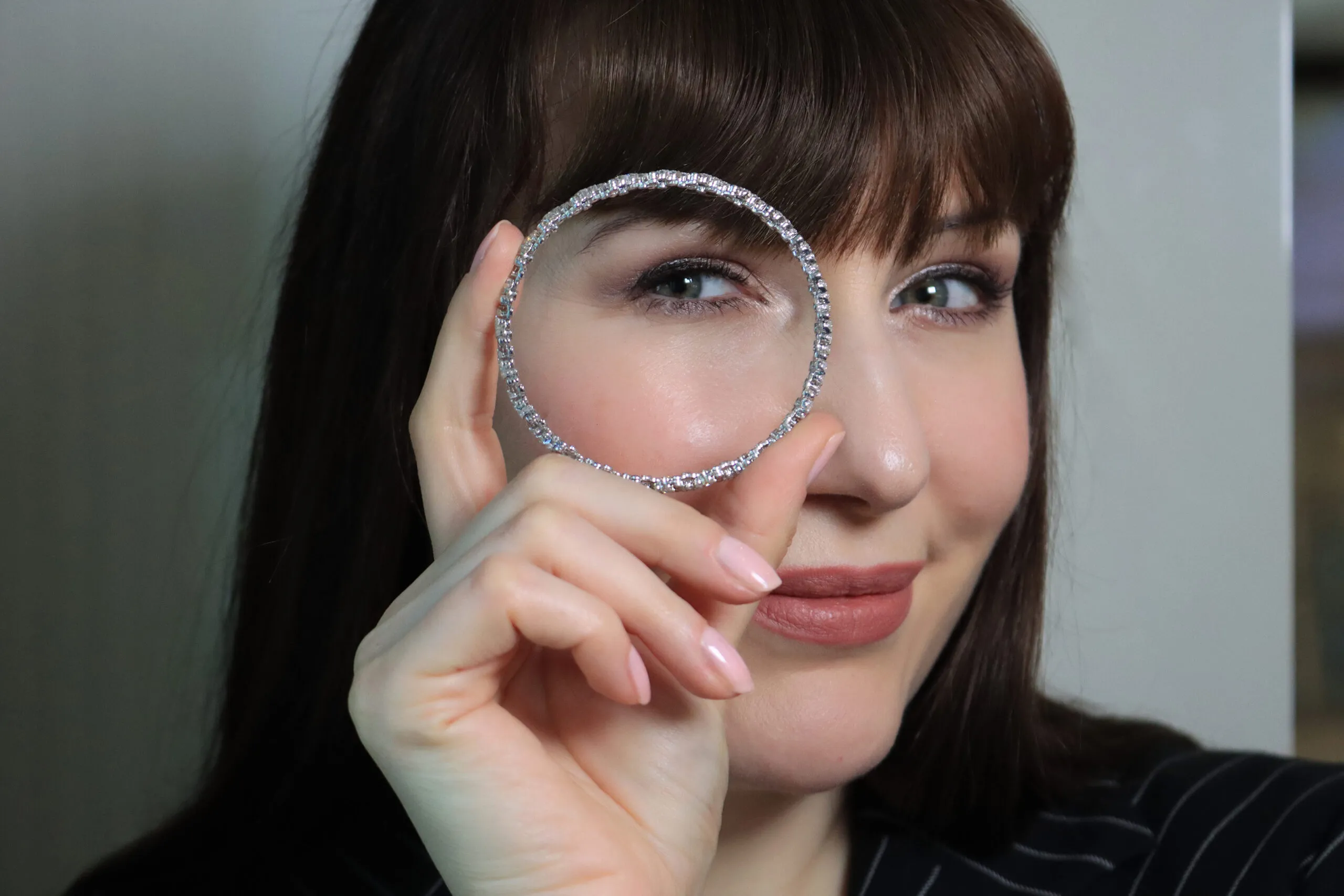 <p>Katerina Perez holds a Serafino collection bracelet, which can contract to be worn as a diamond-set ring</p>