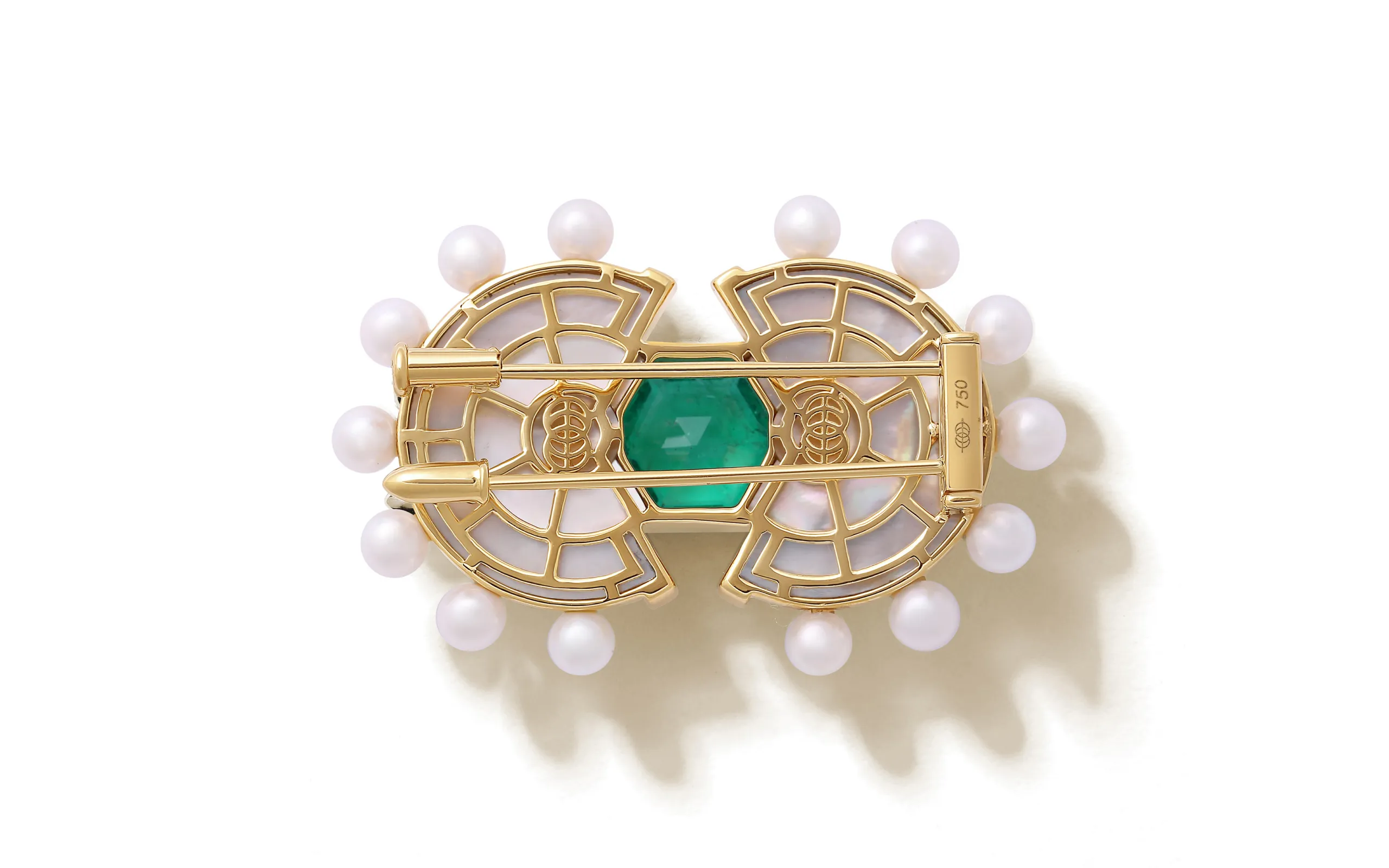 <p>The reverse side of the State Property Raisina Snowdrop brooch with emeralds, diamonds, Akoya pearls, and mother of pearl in 18k gold</p>