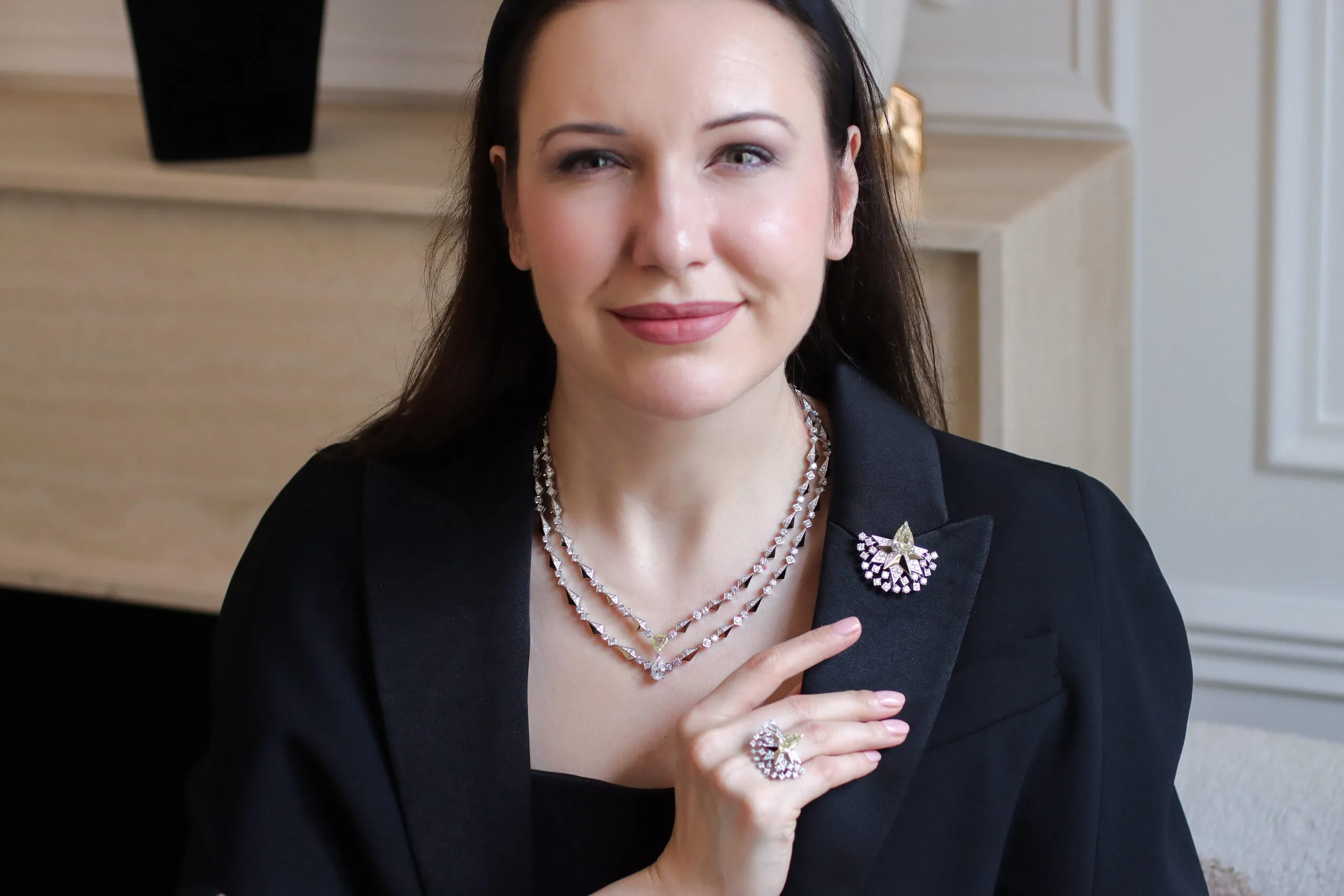 <p>Katerina Perez wears the Sahag Arslanian Sun Rays High Jewellery necklace with the 8.88-carat pear-shaped fancy yellow VS2 diamond in the central motif worn as a brooch, alongside the matching Sun Rays High Jewellery ring with a 3.38-carat pear-shaped fancy yellow VS2 diamond and round white diamonds, all crafted in 18k white and yellow gold  </p>
