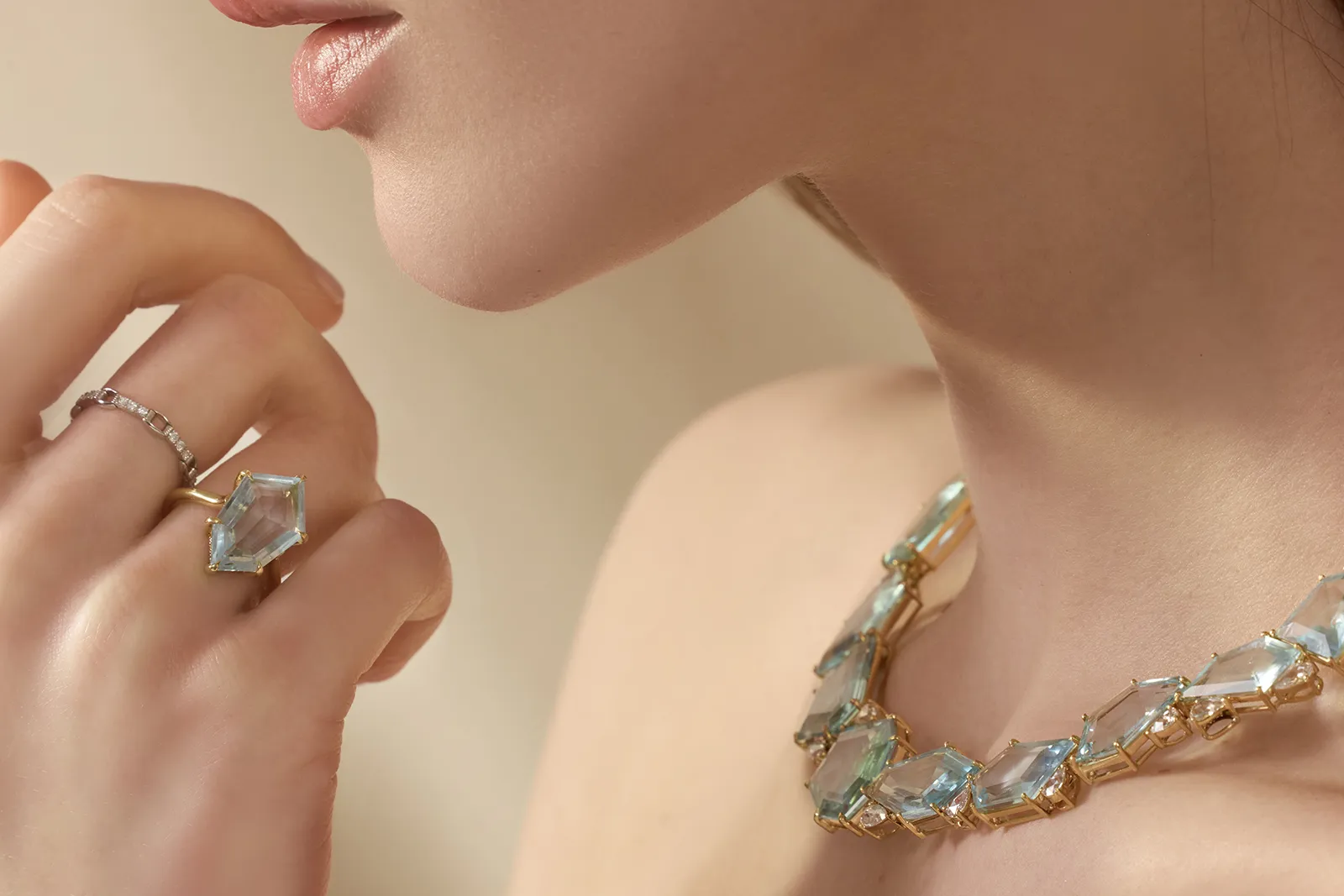 <p>A model wears the Contour Polygon ring by Yi Collection, set with a 5.51 carat aquamarine and diamonds in 18k yellow gold </p>