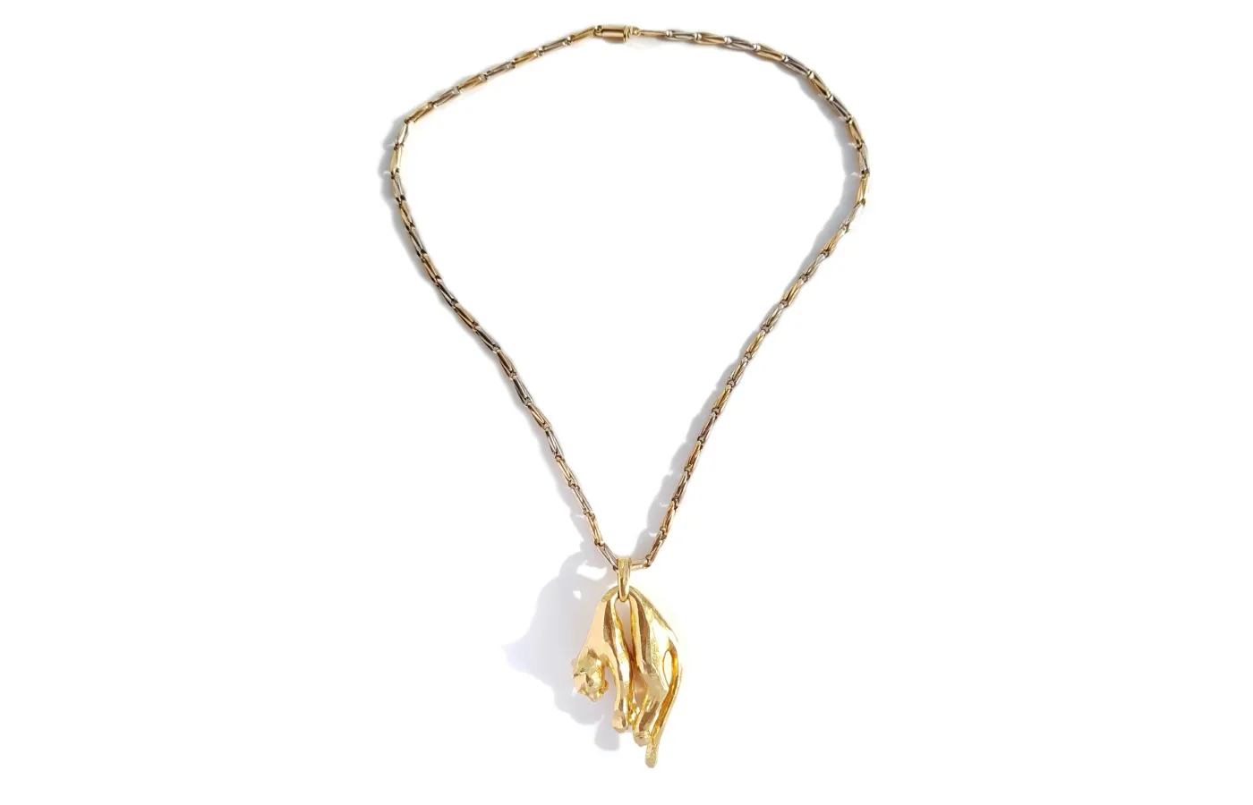 <p>Vintage 1981 Cartier Panthère molle pendant, presented on the original 1980s bi-colour gold chain and an additional silk cord, available at Bloomsbury Manor.</p>