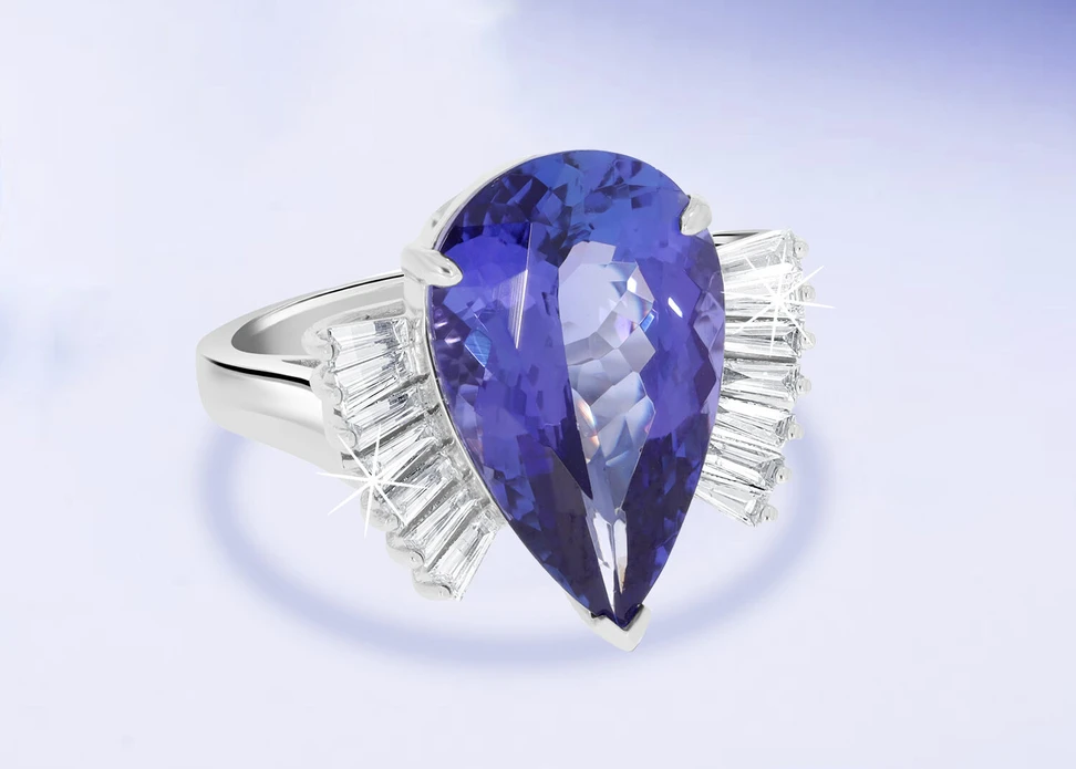 <p>Royal Touch Group 8.58 carat pear-shaped tanzanite ring with tapered baguette-cut diamonds set in 14k white gold</p>
