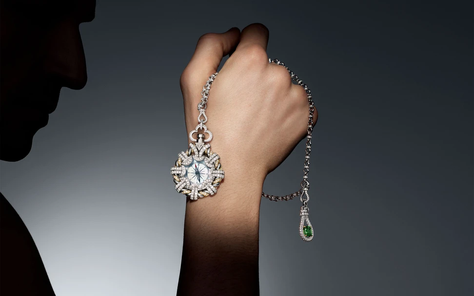 <p>Louis Vuitton Phénoménal Compass in white gold, platinum, yellow gold, and mother of pearl, with a 2.71-carat tsavorite on the outer case and a second, 2.16-carat tsavorite on the chain, from Chapter II of the Awakened Hands, Awakened Minds High Jewellery collection. ©Nathaniel Goldberg</p>