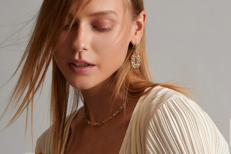 <p>A model wears pieces from the Kalypso collection by Dionysios Fine Jewels, set with multi-coloured oval-cut and pear-shaped gemstones in 18k yellow gold </p>
