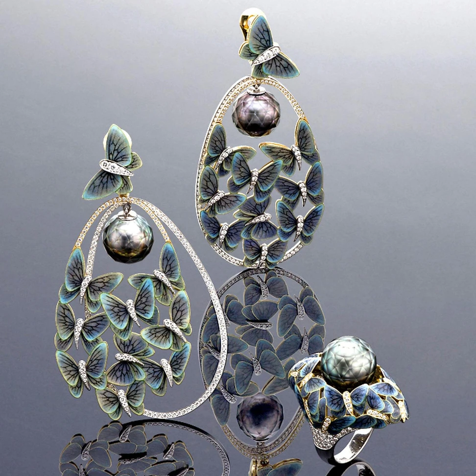 <p>Faceted pearls appear to float among butterflies in this Ilgiz F ring and earrings, winning him the Champion of Champions award</p>