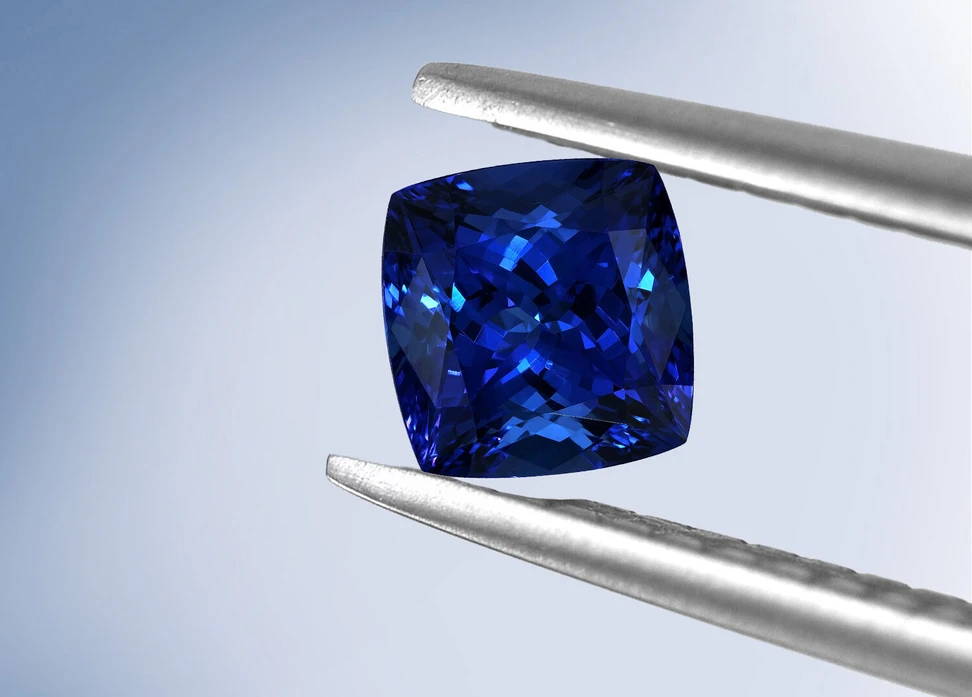 <p>A 34.14 carat cushion-cut GIA Certified AAAA tanzanite gemstone, presented by Royal Touch Group</p>
