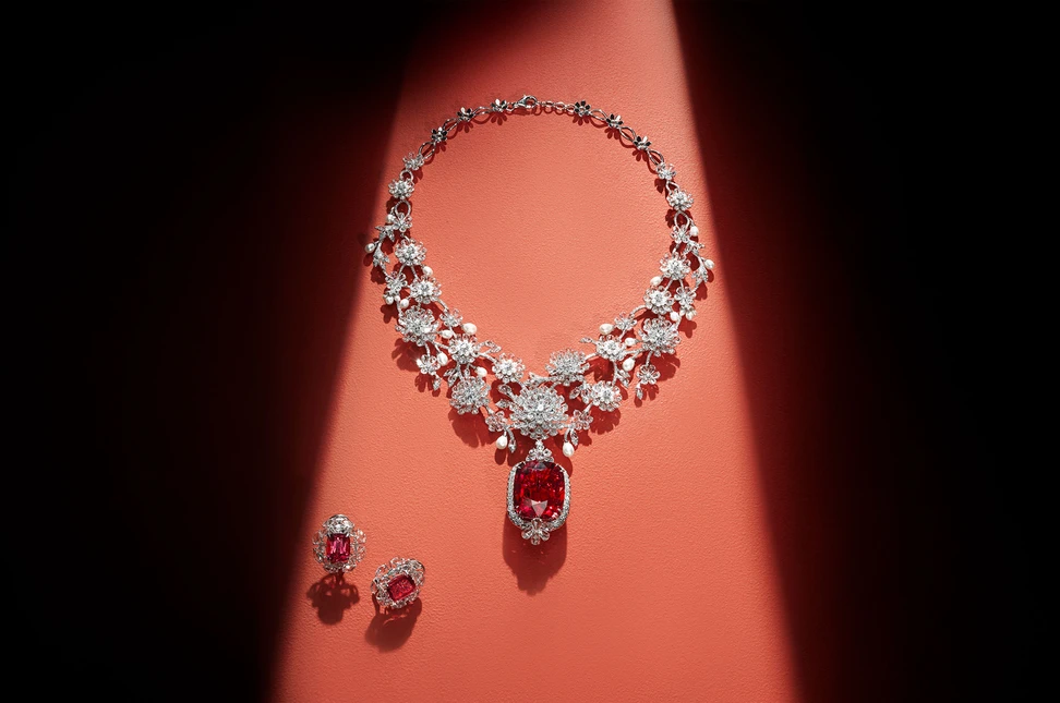 <p>Jaipur Gems Scarlet Bloom necklace with a 68-carat rubellite pendant adorned with diamonds and pearls, shown here with the Twilight Tourmaline drop earrings with 11 carats of tourmalines, framed by diamonds</p>
