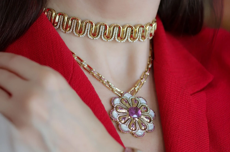 <p>Katerina Perez wears the Miseno Arco High Jewellery choker necklace with 5.09 carats of white diamonds alongside the Arco High Jewellery pendant with 3.73 carats of pink sapphires, 1.84 carats of mother of pearl, 6.16 carats of pink tourmaline, and 1.74 carats of diamonds, both in 18k yellow gold</p>

