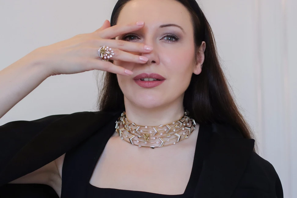 <p>Katerina Perez wears the Sahag Arslanian Celestial Radiance High Jewellery choker with a 10.26-carat cushion-cut fancy deep brownish yellow VS2 diamond, 5.04 carats of princess-cut white diamonds, 5.49 carats of round white diamonds, and 4.83 carats of round white melee, set in 18k white and yellow gold, alongside the Celestial Radiance ring with a 2.44-carat cushion-cut fancy dark brown-yellow VS1 diamond </p>
