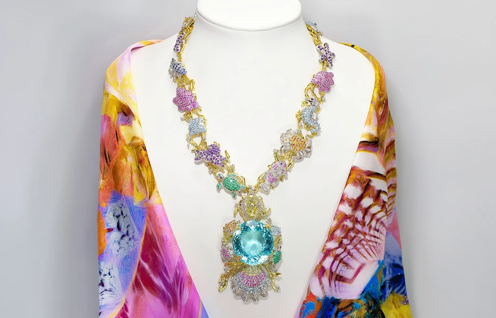 <p>The Ethereal Carolina Divine Paraiba necklace with a 191.87 carat Paraiba tourmaline, an 11-carat yellow diamond, and 1,706 precious and semi-precious gemstones, created by Kaufmann de Suisse President Moneca Kaufmann</p>

