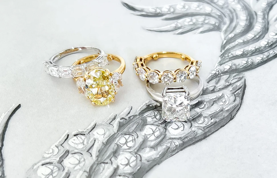 <p>A selection of fancy-cut diamond rings by Valentina Fine Jewellery, including an oval-shaped yellow diamond ring with pear-shaped diamond side stones </p>
