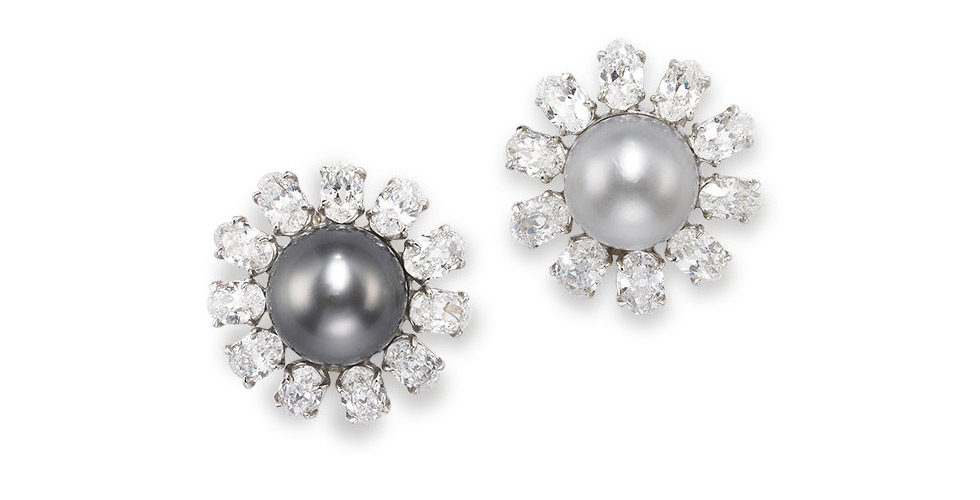 A pair of natural pearl and diamond earrings. Each cluster centring a button-shaped grey natural pearl measuring 11.5 x 12.3mm and a button-shaped white natural pearl measuring 11.0 x 10.4mm. Diamonds approximately 7.25 carats total. Est. $ 160,000 – $ 230,000