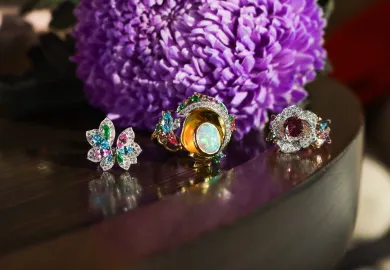 Artisans Bespoke Jewellers rings, including (from left to right) the Angelique ring with blue zircon, tsavorite garnet, pink sapphire and diamonds in 18k white gold; the Khroma ring with a 3.45 carat crystal opal cabochon and zircon, sapphire, garnet, spinel and diamonds in 18k yellow and white gold, and the Botanica Lady Beetle ‘Rose’ ring with a 1.79 carat pink-purple sapphire surrounded by diamonds, and green, purple and pink sapphire leaves, set in 18k rose and white gold