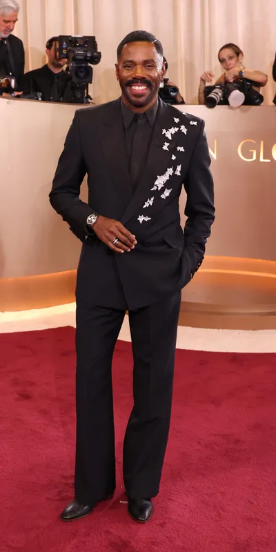 <p>Style icon Colman Domingo in a Valentino suit and a flowing arrangement of ivy leaf brooches by Boucheron</p>

