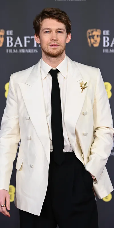 <p>Joe Alwyn wore a Chaumet Foliage brooch from the 1971 heritage collection</p>