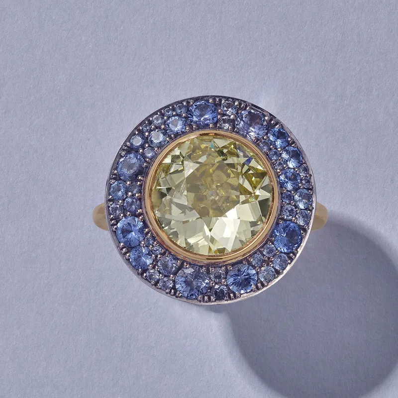 <p>Venus ring in yellow gold, set with a yellow diamond and blue Burmese sapphires</p>
