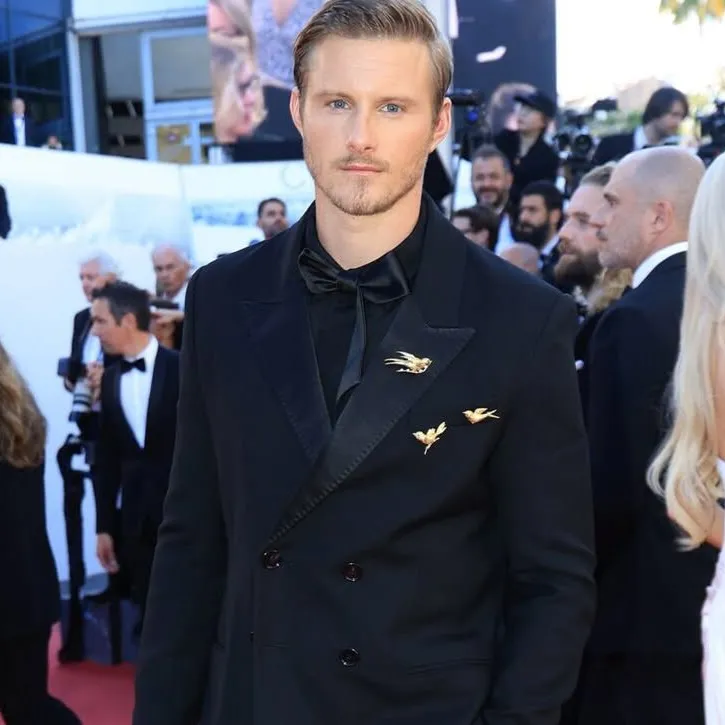<p>Actor Alexander Ludwig chose three heritage brooches by Chaumet, dating from 1962, to accessorise his suit at the 2026 Cannes Film Festival</p>