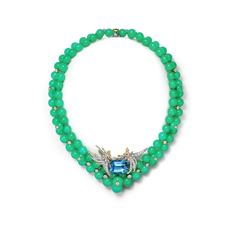 <p>Tiffany &amp; Co. Blue Book Hidden Garden Bird on a Rock transformable necklace in platinum and 18k yellow gold with a 22.60ct cushion-cut aquamarine, chrysoprase beads, round rubies and diamonds The aquamarine element can be worn as a brooch</p>
