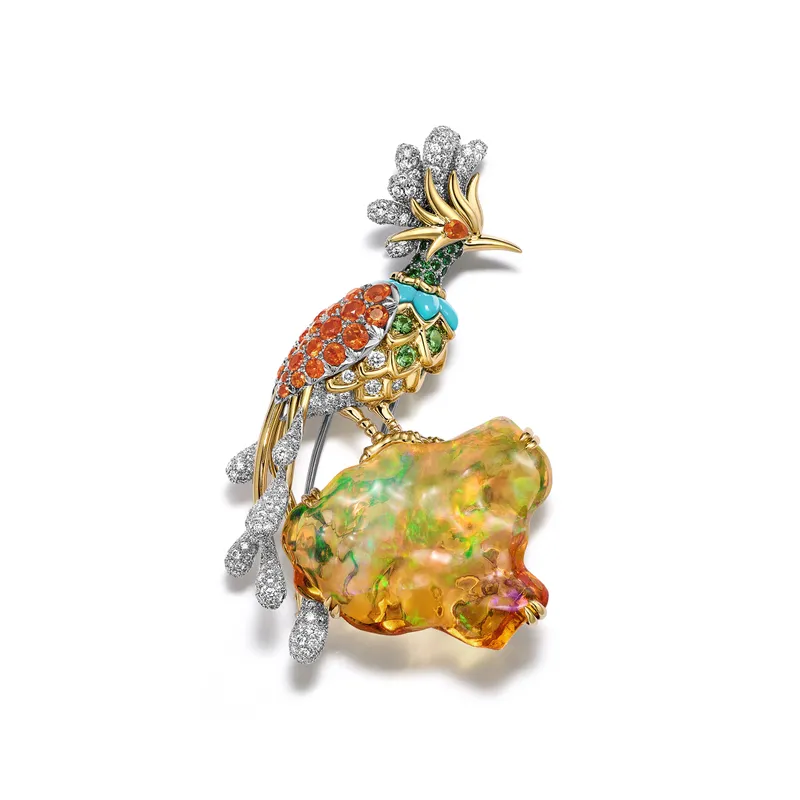 <p>Tiffany &amp; Co. Blue Book Hidden Garden Bird on a Rock Paradise Bird brooch in platinum and 18k yellow gold with a 25.14ct free-form fire opal; emerald, turquoise, tsavorite, fire opals and diamonds</p>

