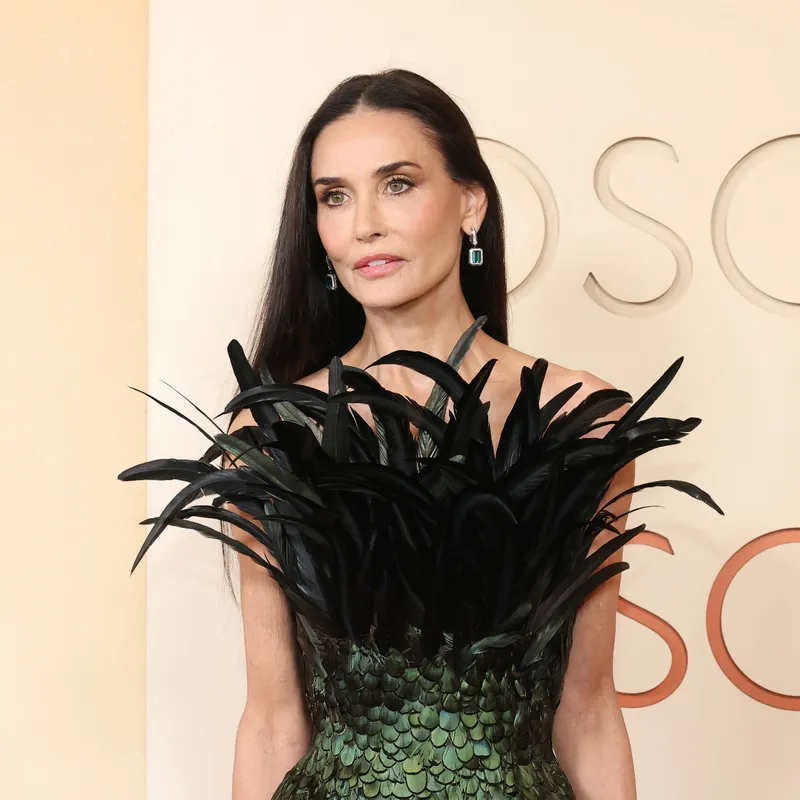 <p>Demi Moore wears the Vendôme Liseré sleepers in white gold, set with blue emerald-cut tourmalines, diamonds and black lacquer, Vendôme Liseré ring in white gold, set with a 4.13ct emerald-cut diamond, round diamonds and black lacquer, Vendôme Liseré bracelet in white gold, set with round diamonds, emerald-cut diamonds and black lacquer and Ruban Diamants transformable piece in a bracelet version from Histoire de Style, Art Déco high jewellery collection in white gold, set with diamonds</p>
